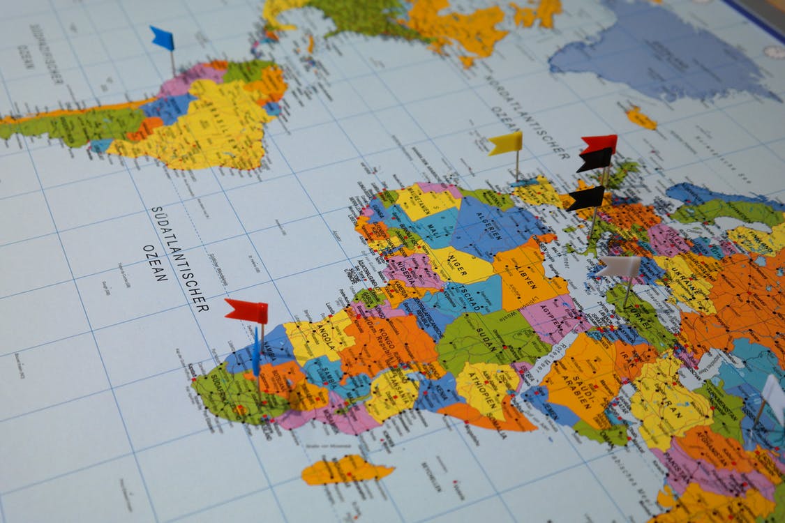 World map with flag pins